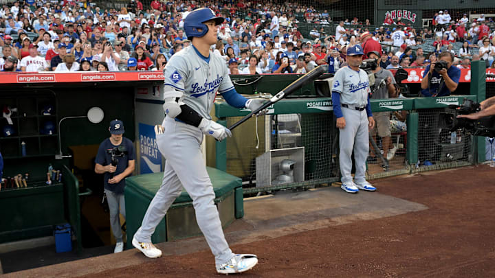 Sep 3, 2024; Anaheim, California, USA;  Los Angeles Dodgers designated hitter Shohei Ohtani (17) walks out of the dugout for his first at bat in the game against the Los Angeles Angels at Angel Stadium. Mandatory Credit: Jayne Kamin-Oncea-Imagn Images