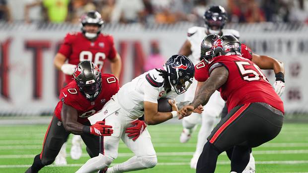 Houston Texans quarterback C.J. Stroud (7) is sacked by Tampa Bay Buccaneers linebacker Yaya Diaby (0). 
