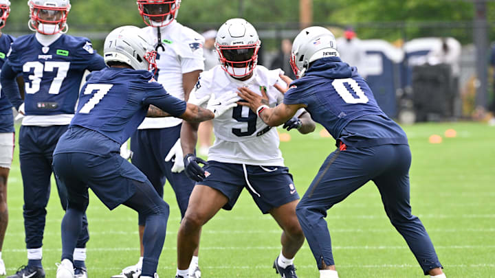 Jun 9, 2025; Foxborough, MA, USA; New England Patriots wide receiver Kayshon Boutte (9) works with cornerback Carlton Davis III (7) and cornerback Christian Gonzalez (0) during minicamp at Gillette Stadium. Mandatory Credit: Eric Canha-Imagn Images