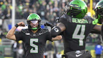 Nov 22, 2025; Eugene, Oregon, USA; Oregon Ducks quarterback Dante Moore (5) celebrates after scoring a touchdown against the Southern California Trojans during the second half at Autzen Stadium. Mandatory Credit: Troy Wayrynen-Imagn Images