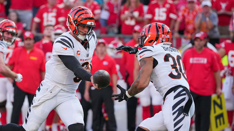 Sep 15, 2024; Kansas City, Missouri, USA; Cincinnati Bengals quarterback Joe Burrow (9) hands off to running back Chase Brown (30) against the Kansas City Chiefs during the game at GEHA Field at Arrowhead Stadium. Mandatory Credit: Denny Medley-Imagn Images | Denny Medley-Imagn Images