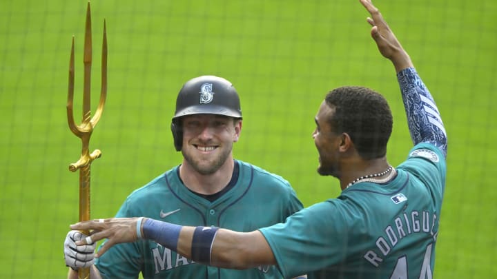 Seattle left fielder Luke Raley (left) celebrates his home run with Julio Rodriguez (44) in Cleveland earlier this month.