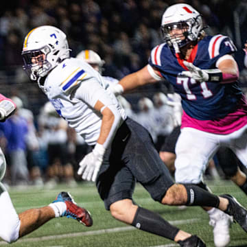 Urbandale's Jaylon Brooks (1) runs to the outside during a game against Johnston on Friday, Oct. 18, 2024, at Frerichs Field in Urbandale.