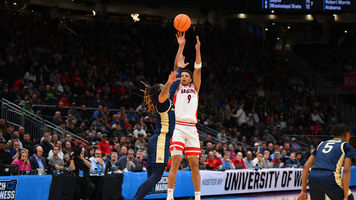 Mar 21, 2025; Seattle, WA, USA; Arizona Wildcats forward Carter Bryant (9) shoots the ball against the Akron Zips during the first half in the first round of the NCAA Tournament at Climate Pledge Arena. Mandatory Credit: Steven Bisig-Imagn Images