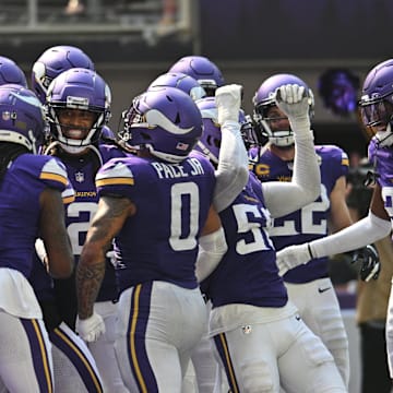 Sep 15, 2024; Minneapolis, Minnesota, USA; The Minnesota Vikings react after an interception by safety Josh Metellus (obscured in center) against the San Francisco 49ers during the third quarter U.S. Bank Stadium. Mandatory Credit: Jeffrey Becker-Imagn Images