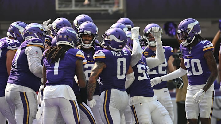 Sep 15, 2024; Minneapolis, Minnesota, USA; The Minnesota Vikings react after an interception by safety Josh Metellus (obscured in center) against the San Francisco 49ers during the third quarter U.S. Bank Stadium. Mandatory Credit: Jeffrey Becker-Imagn Images