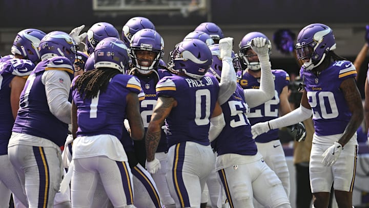 Sep 15, 2024; Minneapolis, Minnesota, USA; The Minnesota Vikings react after an interception by safety Josh Metellus (obscured in center) against the San Francisco 49ers during the third quarter U.S. Bank Stadium.