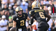 Oct 18, 2025; Nashville, Tennessee, USA;  Vanderbilt Commodores quarterback Diego Pavia (2) tosses the ball to wide receiver Tre Richardson (6) against the Louisiana State Tigers during the second half at FirstBank Stadium. Mandatory Credit: Steve Roberts-Imagn Images