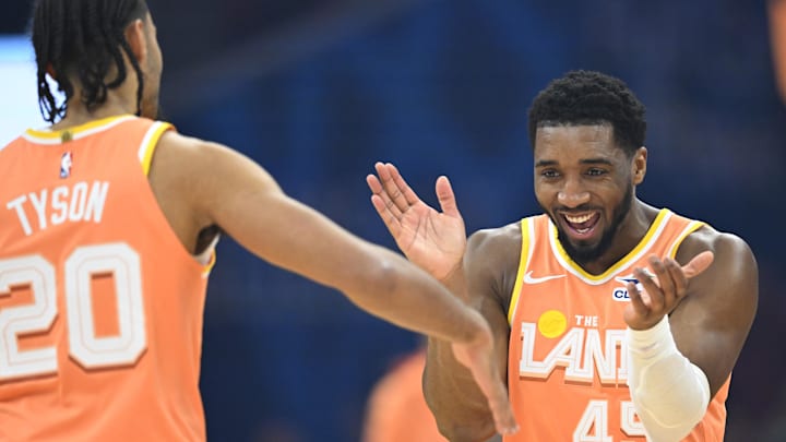 Jan 26, 2026; Cleveland, Ohio, USA; Cleveland Cavaliers guard Jaylon Tyson (20) and guard Donovan Mitchell (45) celebrate in the first quarter against the Orlando Magic at Rocket Arena. Mandatory Credit: David Richard-Imagn Images