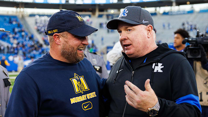 Nov 16, 2024; Lexington, Kentucky, USA; Kentucky Wildcats head coach Mark Stoops talks with Murray State Racers head coach Jody Wright after the game at Kroger Field. Mandatory Credit: Jordan Prather-Imagn Images