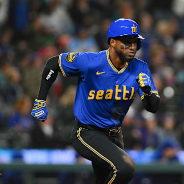 Seattle Mariners right fielder Victor Robles (10) runs towards first base after hitting a double against the Texas Rangers during the ninth inning at T-Mobile Park on Sept 14.