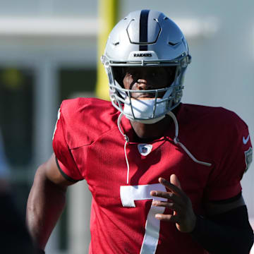 Jul 24, 2025; Henderson, NV, USA; Las Vegas Raiders quarterback Geno Smith (7) with coach Pete Carroll during training camp at the Intermountain Healthcare Performance Center. Mandatory Credit: Kirby Lee-Imagn Images