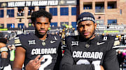Nov 29, 2024; Boulder, Colorado, USA; Colorado Buffaloes quarterback Shedeur Sanders (2) and safety Shilo Sanders (21) pose for a photo before the game against the Oklahoma State Cowboys at Folsom Field. 