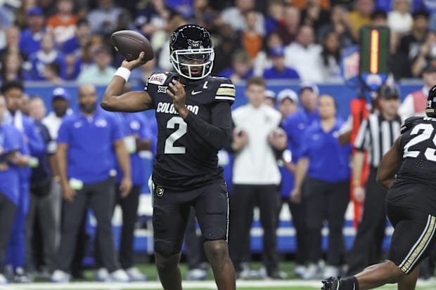 Colorado Buffaloes quarterback Shedeur Sanders attempts a pass during the first quarter against the BYU Cougars.