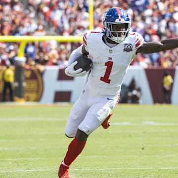 Sep 15, 2024; Landover, Maryland, USA; New York Giants wide receiver Malik Nabers (1) runs down the field pressured by Washington Commanders defensive back Juan Martin (20) in the first half at Commanders Field.  