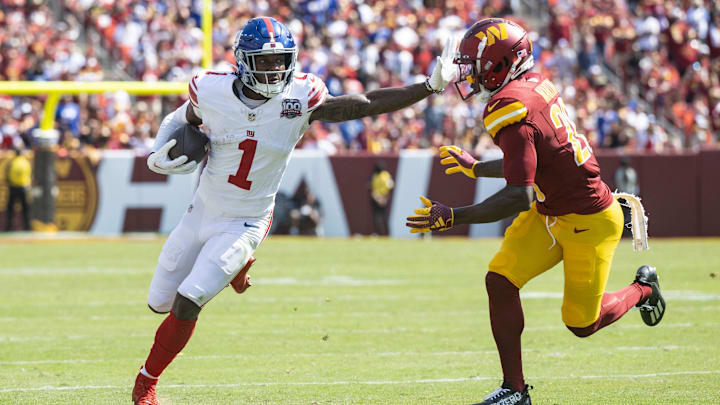 Sep 15, 2024; Landover, Maryland, USA; New York Giants wide receiver Malik Nabers (1) runs down the field pressured by Washington Commanders defensive back Juan Martin (20) in the first half at Commanders Field.  