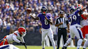 Sep 14, 2025; Baltimore, Maryland, USA; Baltimore Ravens quarterback Lamar Jackson (8) attempts a pass during the first quarter at M&T Bank Stadium. Mandatory Credit: Peter Casey-Imagn Images