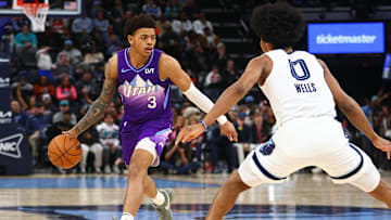 Jan 25, 2025; Memphis, Tennessee, USA; Utah Jazz guard Keyonte George (3) dribbles the ball against Memphis Grizzlies forward Jaylen Wells (0) during the third quarter at FedExForum. Mandatory Credit: Petre Thomas-Imagn Images