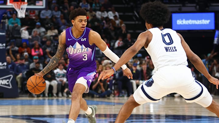 Jan 25, 2025; Memphis, Tennessee, USA; Utah Jazz guard Keyonte George (3) dribbles the ball against Memphis Grizzlies forward Jaylen Wells (0) during the third quarter at FedExForum. Mandatory Credit: Petre Thomas-Imagn Images Jan 25, 2025; Memphis, Tennessee, USA; Utah Jazz guard Keyonte George (3) dribbles the ball against Memphis Grizzlies forward Jaylen Wells (0) during the third quarter at FedExForum. Mandatory Credit: Petre Thomas-Imagn Images