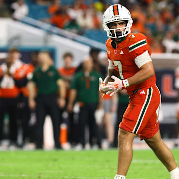 Sep 7, 2024; Miami Gardens, Florida, USA; Miami Hurricanes wide receiver Xavier Restrepo (7) at the line of scrimmage against the Florida A&M Rattlers during the third quarter at Hard Rock Stadium. Mandatory Credit: Sam Navarro-Imagn Images