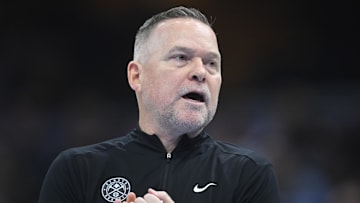 Dec 5, 2024; Cleveland, Ohio, USA; Denver Nuggets head coach Michael Malone walks on the court in the second quarter against the Cleveland Cavaliers at Rocket Mortgage FieldHouse. Mandatory Credit: David Richard-Imagn Images