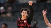 Dec 21, 2024; San Jose, California, USA; San Diego State Aztecs guard Miles Byrd (21) gestures after making a three point basket against the California Golden Bears during the second half at SAP Center. Mandatory Credit: Darren Yamashita-Imagn Images