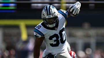 Sep 28, 2025; Foxborough, Massachusetts, USA; Carolina Panthers running back Chuba Hubbard (30) runs against the New England Patriots during the first half at Gillette Stadium. Mandatory Credit: Brian Fluharty-Imagn Images