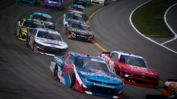 Drivers maneuver through turn one during the NASCAR Xfinity Series Tennessee Lottery 250
