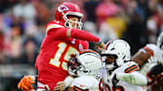 Dec 15, 2024; Cleveland, Ohio, USA; Cleveland Browns defensive tackle Mike Hall Jr. (51) and linebacker Devin Bush (30) rush Kansas City Chiefs quarterback Patrick Mahomes (15) during the second half at Huntington Bank Field. Mandatory Credit: Ken Blaze-Imagn Images