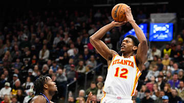Hunter shooting a jump shot over Utah Jazz guard Isaiah Collier.
