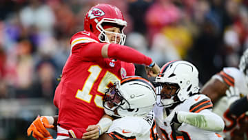 Dec 15, 2024; Cleveland, Ohio, USA; Cleveland Browns defensive tackle Mike Hall Jr. (51) and linebacker Devin Bush (30) rush Kansas City Chiefs quarterback Patrick Mahomes (15) during the second half at Huntington Bank Field. Mandatory Credit: Ken Blaze-Imagn Images