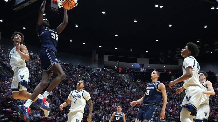 Mar 20, 2026; San Diego, CA, USA; Utah State Aggies forward Adlan Elamin (35) shoots against Villanova Wildcats guard Tyler Perkins (4) in the first half during a first round game of the men's 2026 NCAA Tournament at Viejas Arena. Mandatory Credit: Kirby Lee-Imagn Images