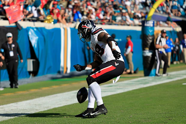 Houston Texans running back Joe Mixon (28) spins the ball before dancing in the endzone celebrating his touchdown 
