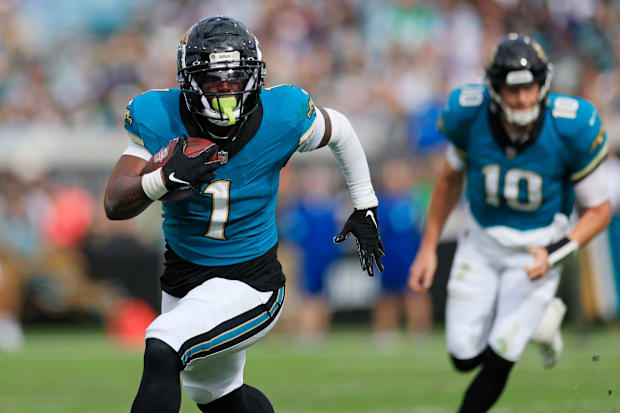 Jacksonville Jaguars running back Travis Etienne Jr. rushes for yards during the second quarter at EverBank Stadium