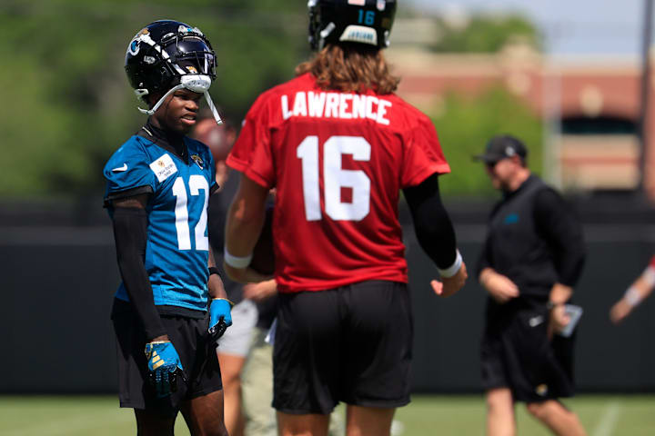 Jacksonville Jaguars wide receiver Travis Hunter talks with quarterback Trevor Lawrence during OTAs. 