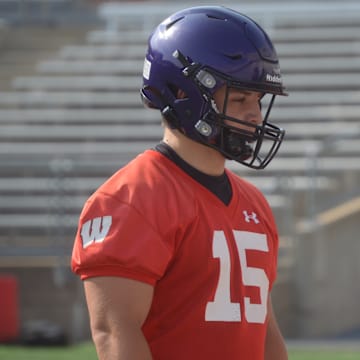 Waunakee's McCoy Smith, left, watches Wisconsin tight ends coach Nate Letton give instructions during Badgers summer camp June 10.
