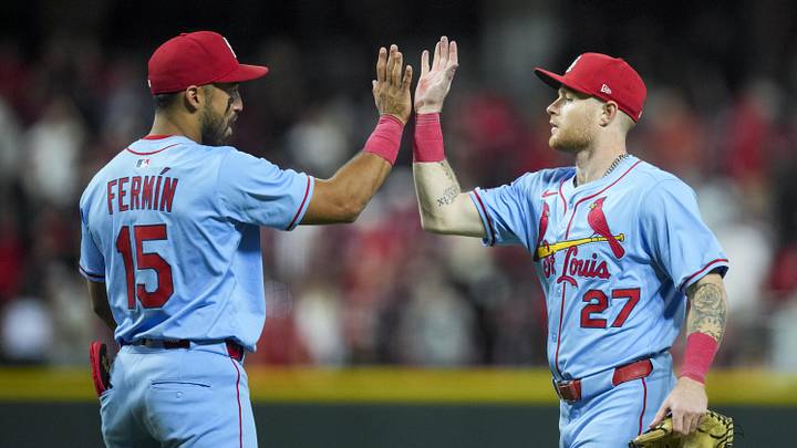 Aug 30, 2025; Cincinnati, Ohio, USA; St. Louis Cardinals second baseman Jose Fermin (15) high-fives outfielder Nathan Church (27) after the final out against the Cincinnati Reds in the ninth inning at Great American Ball Park. Mandatory Credit: Aaron Doster-Imagn Images