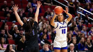 Johnston's Jenica Lewis (10) takes a shot over Iowa City Liberty's Ava Casey (1) on Monday, March 3, 2025, at Wells Fargo Arena.