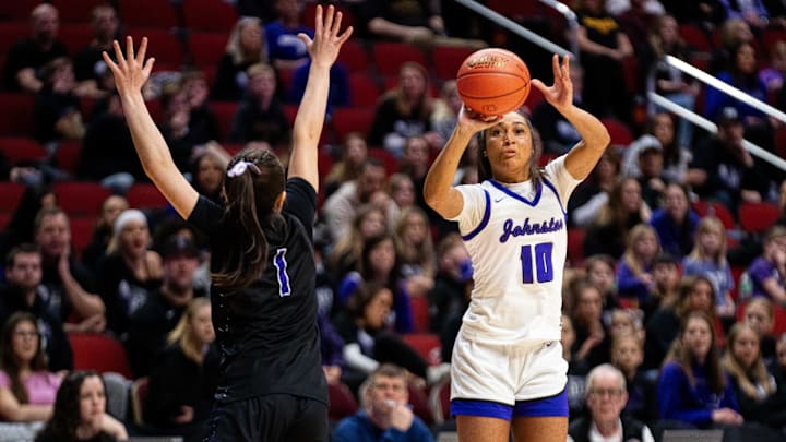 Johnston's Jenica Lewis (10) takes a shot over Iowa City Liberty's Ava Casey (1) on Monday, March 3, 2025, at Wells Fargo Arena.