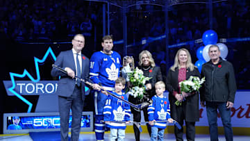 Nov 5, 2025; Toronto, Ontario, CAN; Toronto Maple Leafs General Manager Brad Treliving presents Toronto Maple Leafs center John Tavares (91) with a silver stick for his 500th career goals in the NHL before a game against the Utah Mammoth at Scotiabank Arena. Mandatory Credit: Nick Turchiaro-Imagn Images