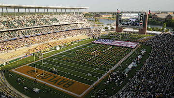 Sep 11, 2021; Waco, Texas, USA; The United States flag drapes the field during the national anthem before the game between the Baylor Bears and the Texas Southern Tigers at McLane Stadium. Mandatory Credit: Scott Wachter-Imagn Images