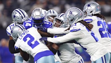 Nov 30, 2023; Arlington, Texas, USA; Seattle Seahawks wide receiver DK Metcalf (14) is tackled by Dallas Cowboys cornerback Jourdan Lewis (2) and cornerback Stephon Gilmore (21) during the first half at AT&T Stadium. Mandatory Credit: Tim Heitman-Imagn Images
