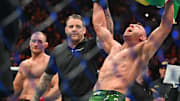 Jan 20, 2024; Toronto, Canada, USA; Dricus Du Plessis (blue gloves) celebrates defeating Sean Strickland (red glove) during UFC 297 at ScotiaBank Arena. Mandatory Credit: Dan Hamilton-Imagn Images