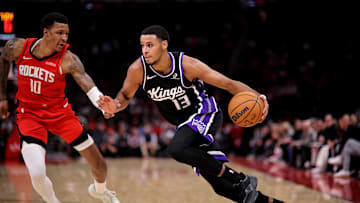 Dec 3, 2025; Houston, Texas, USA; Sacramento Kings forward Keegan Murray (13) drives to the basket against Houston Rockets forward Jabari Smith Jr. (10) during the third quarter at Toyota Center. Mandatory Credit: Erik Williams-Imagn Images