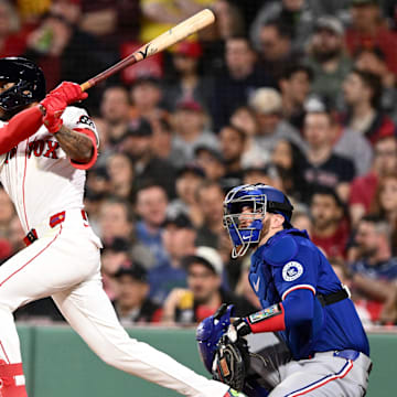 May 7, 2025; Boston, Massachusetts, USA; Boston Red Sox center fielder Ceddanne Rafaela (3) hits a single against the Texas Rangers during the seventh inning at Fenway Park. Mandatory Credit: Brian Fluharty-Imagn Images