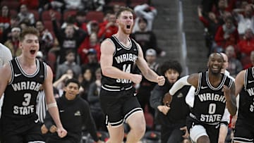 Nov 12, 2022; Louisville, Kentucky, USA;  Wright State Raiders forward Brandon Noel (14) celebrates with teammates after times expires in the second half against the Louisville Cardinals at KFC Yum! Center. Wright State defeated Louisville 73-72. Mandatory Credit: Jamie Rhodes-Imagn Images