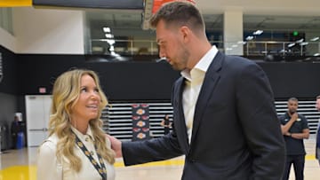 Aug 2, 2025; El Segundo, CA, USA; Los Angeles Lakers Luka Doncic (77) talks with team co-owner Jeanie Buss following a press conference announcing the signing of a 3-year, $165 million contract extension at UCLA Health Training Center. Mandatory Credit: Jayne Kamin-Oncea-Imagn Images