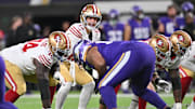 Oct 23, 2023; Minneapolis, Minnesota, USA; San Francisco 49ers quarterback Brock Purdy (13) controls the offense as offensive tackle Spencer Burford (74) prepares to block against the Minnesota Vikings during the first quarter at U.S. Bank Stadium. Mandatory Credit: Jeffrey Becker-Imagn Images