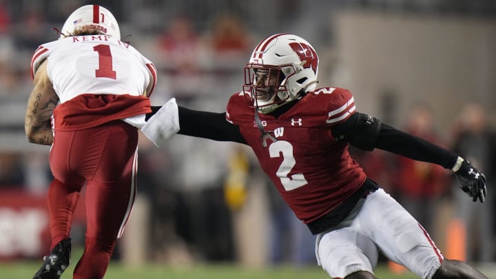 Wisconsin cornerback Ricardo Hallman (2) misses a tackle on Nebraska wide receiver Billy Kemp IV (1) during the second quarter of their game Saturday, November 18, 2023 at Camp Randall Stadium in Madison, Wisconsin.