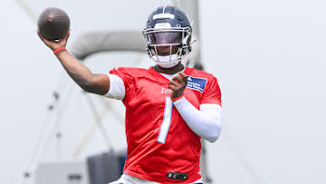 May 10, 2025; Nashville, TN, USA;  Tennessee Titans quarterback Cam Ward (1) throws a pass as he goes through throwing drills during Rookie Mini Camp at Saint Thomas Sports Park. Mandatory Credit: Steve Roberts-Imagn Images
